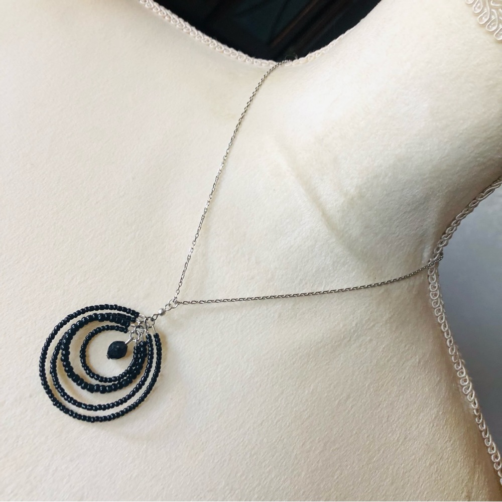 Hand crafted seed bead spiral globe pendant on chain necklace
